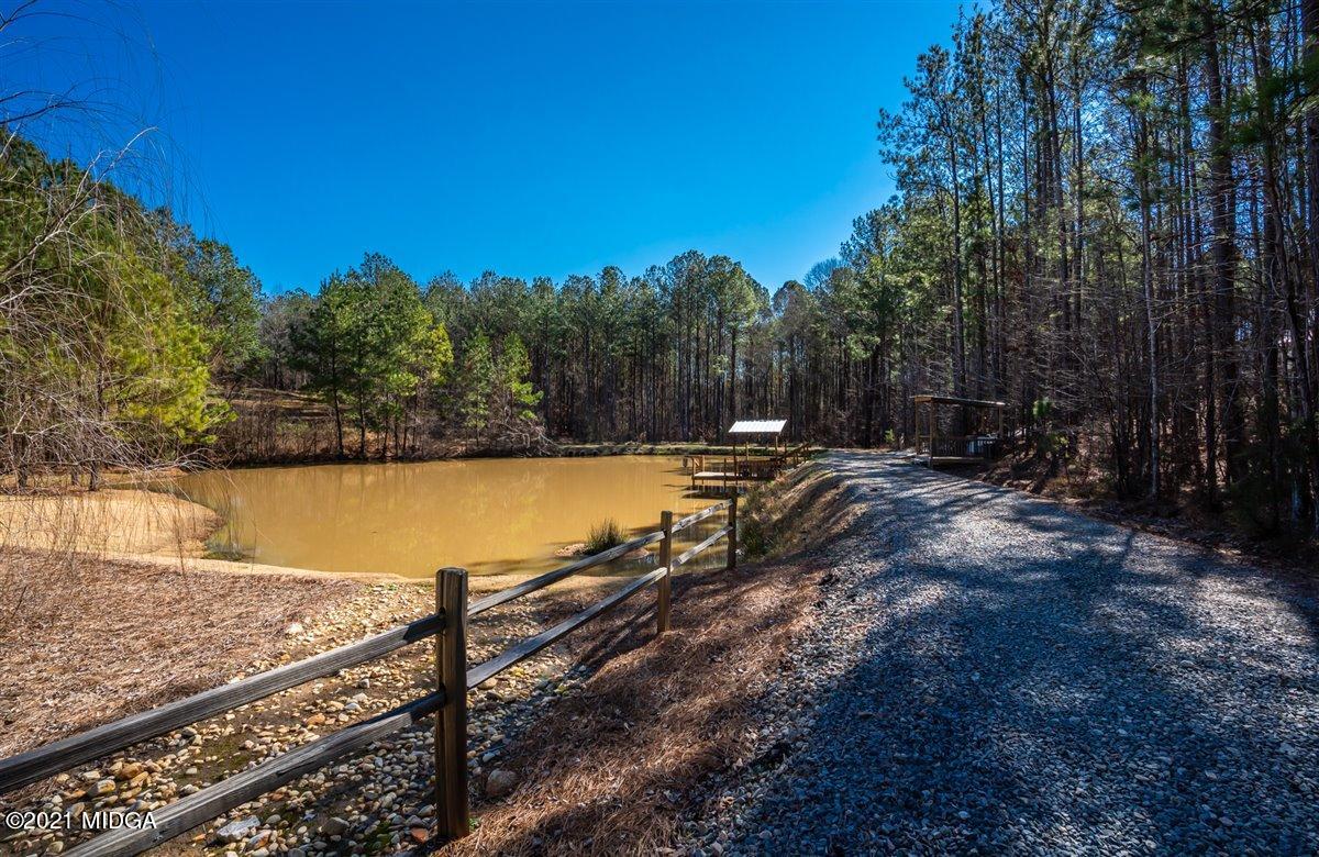 725 Taylor Road Juliette, GA 31046 - Photo 50 of 62 a view of a swimming pool with a patio and a yard