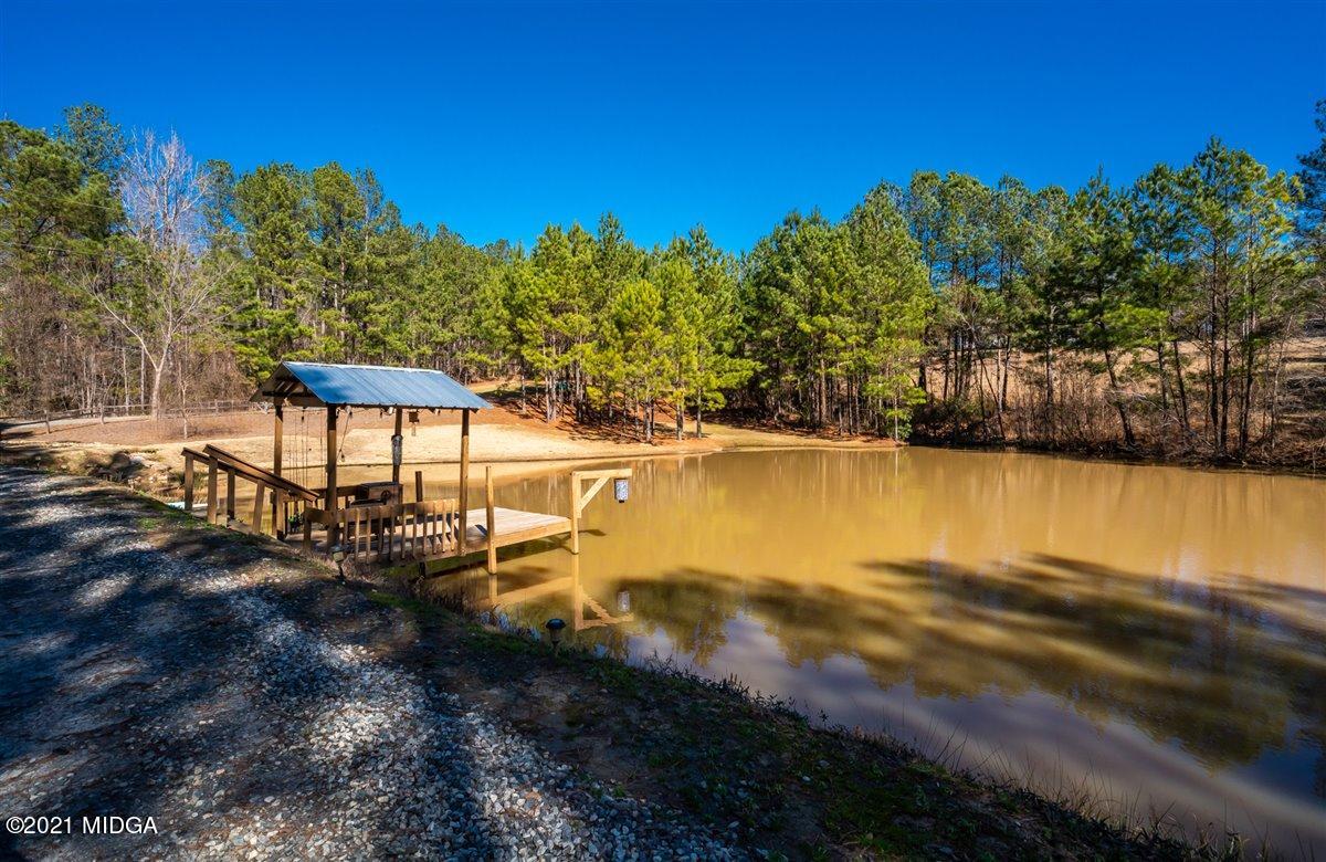 725 Taylor Road Juliette, GA 31046 - Photo 51 of 62 a view of a lake with houses in the back