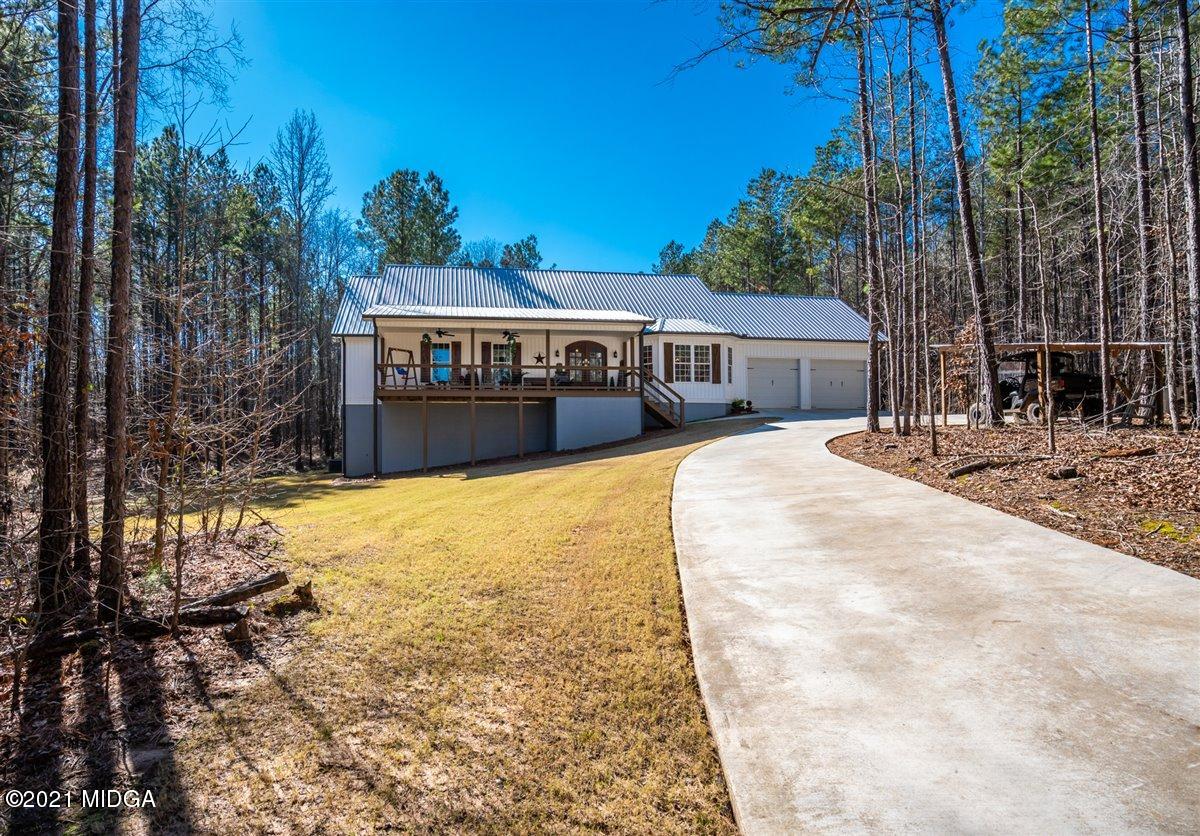 725 Taylor Road Juliette, GA 31046 - Photo 55 of 62 a view of a house with a yard