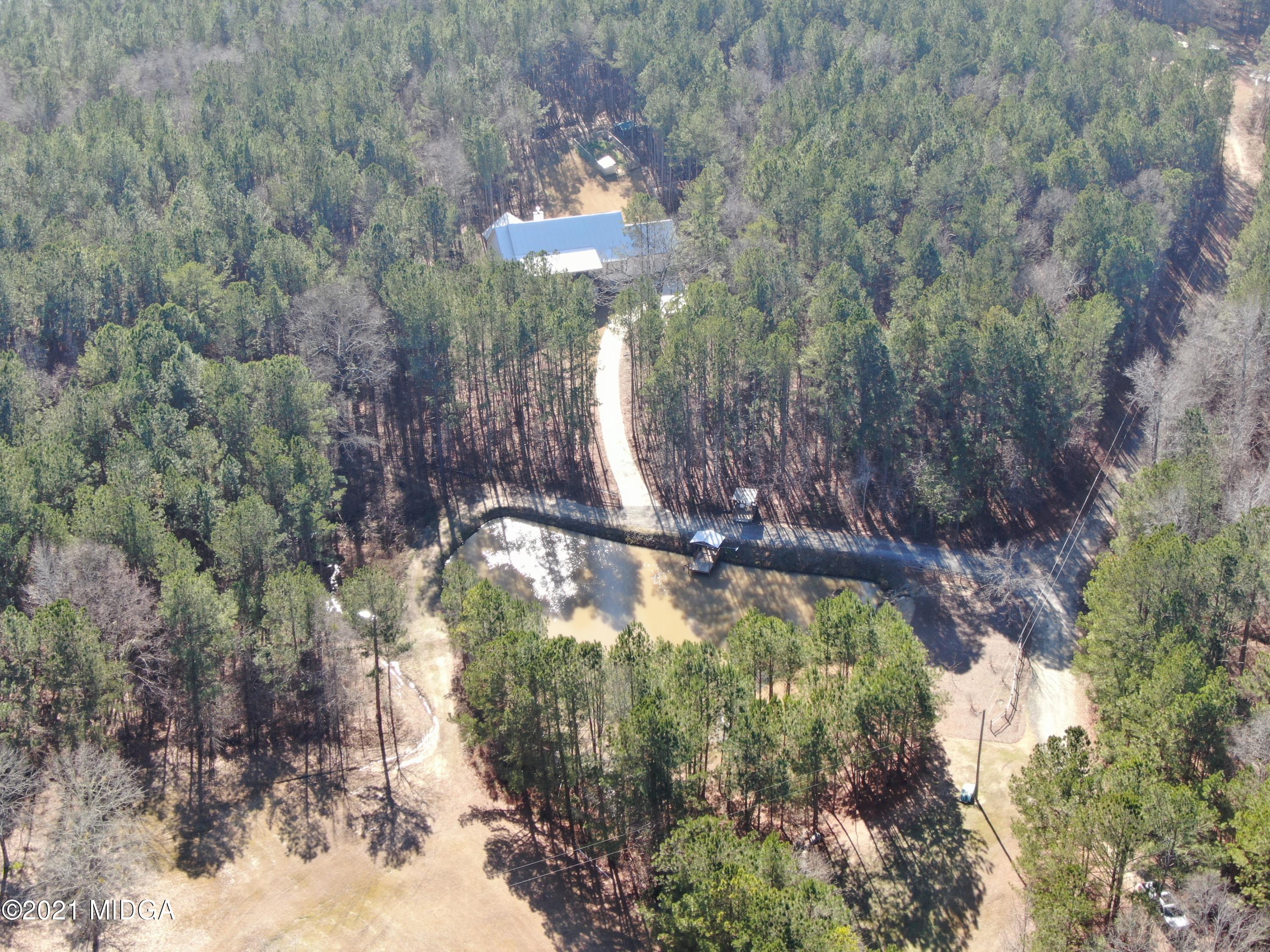 725 Taylor Road Juliette, GA 31046 - Photo 58 of 62 a view of a swimming pool with a yard