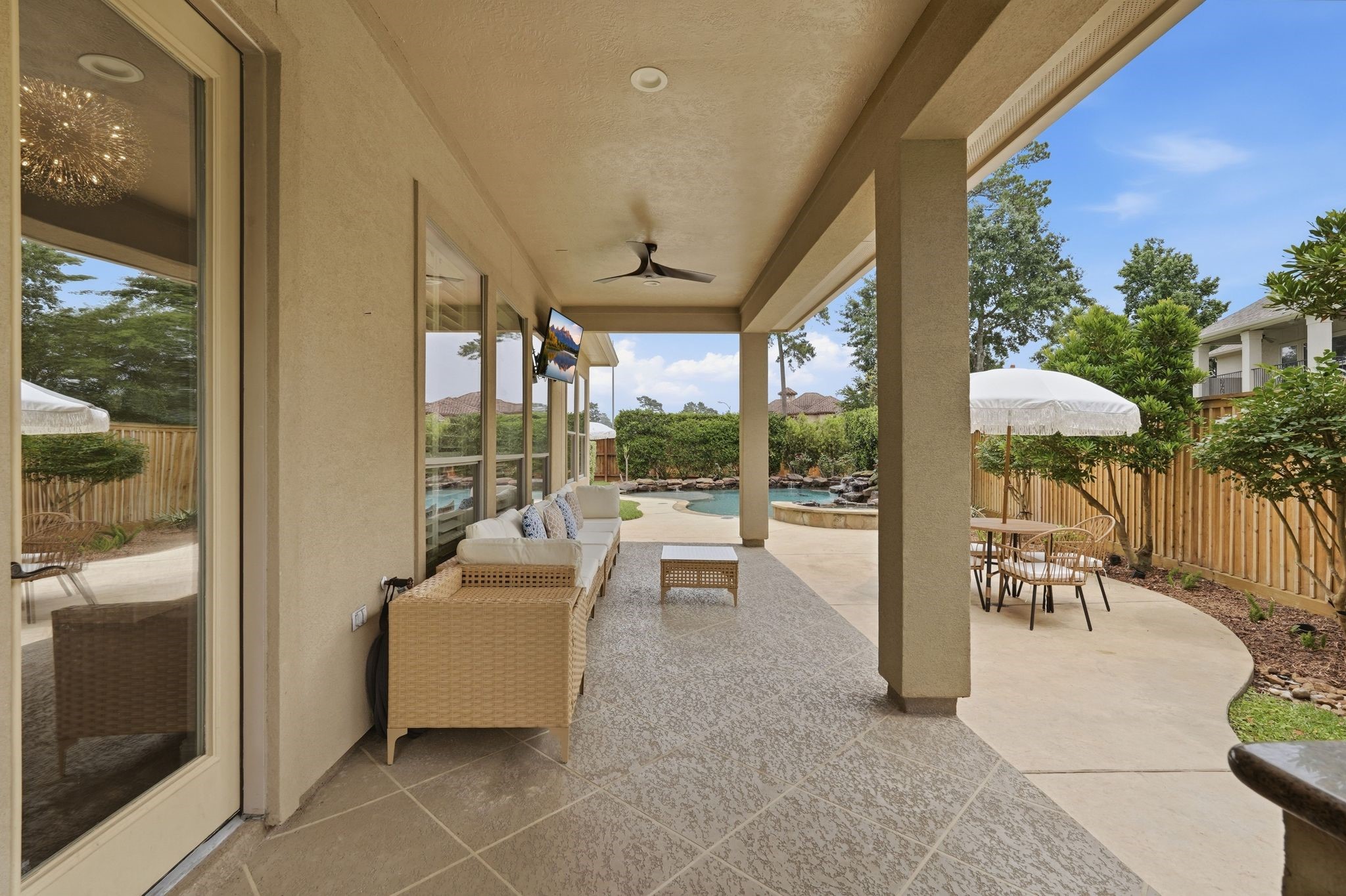 7603 Hogan Bridge Court Spring, TX 77389 - Photo 40 of 50 Covered patio and extended decking create the perfect setting for relaxing poolside days and effortless outdoor entertaining.