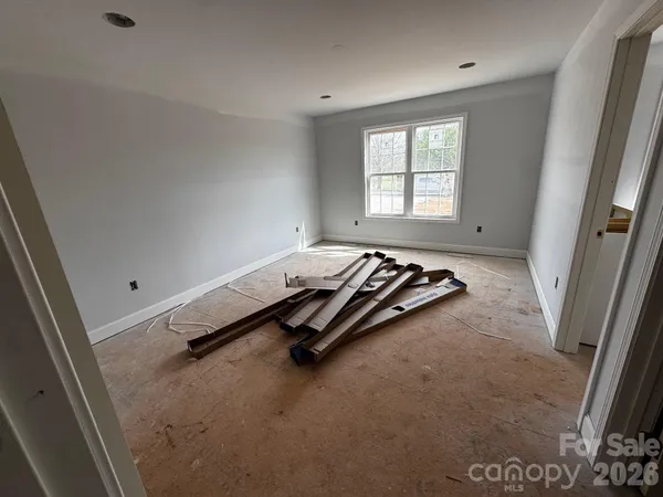 a room with a bed and a window