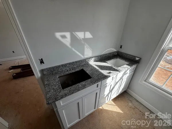 a kitchen with a stove and a sink