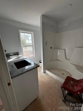 a kitchen with a stove and a refrigerator
