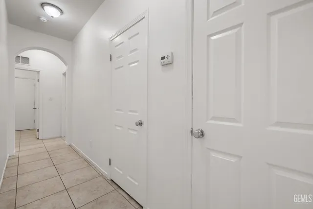 a bathroom with a sink vanity and a toilet