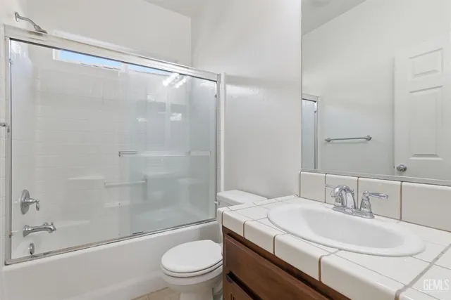 a view of a backyard with plants and a garden