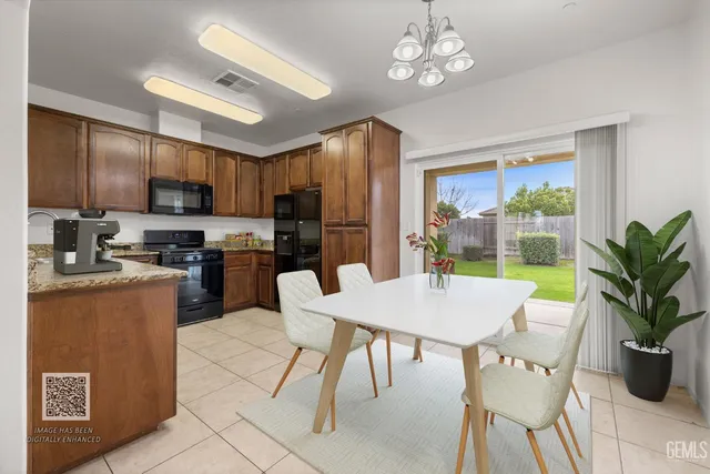 a large kitchen with a table and chairs in it