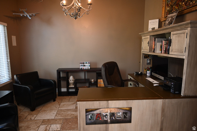 314 Brown Farm Lane Draper, UT 84020 - Photo 15 of 57 Dedicated office space featuring expansive built-in desk cabinetry, a decorative chandelier, and tile flooring