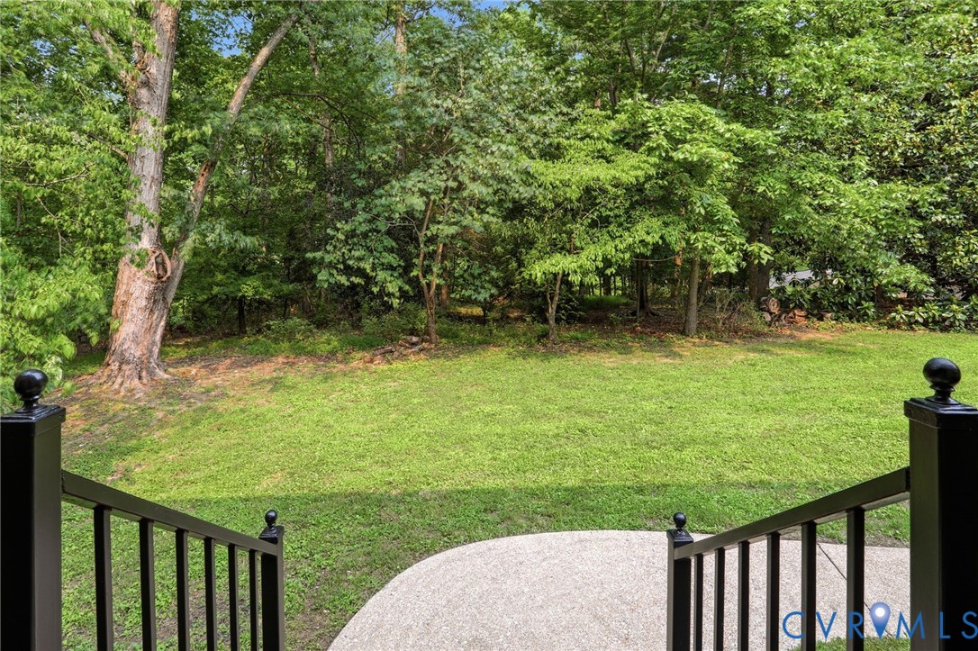 2904 Old Gun Road West Midlothian, VA 23113 - Photo 45 of 59 Expansive green lawn surrounded by mature trees, f