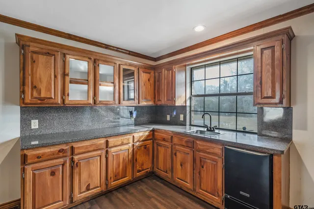 a kitchen with stainless steel appliances granite countertop a stove and a microwave