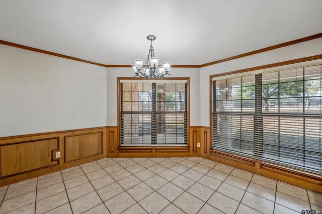 a kitchen with stainless steel appliances kitchen island granite countertop a sink and cabinets
