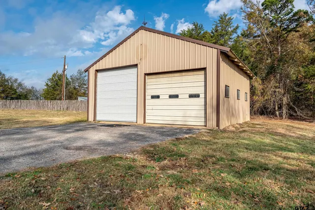 an aerial view of a house with outdoor space
