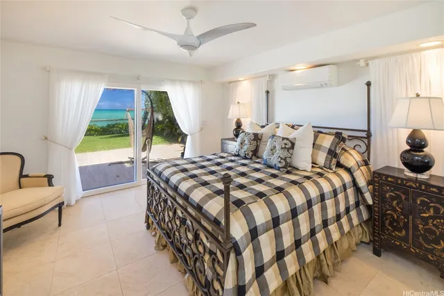 a bedroom with a bed and a couch