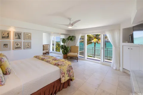 a spacious bedroom with a large bed and a large window