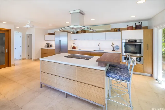 a kitchen with a sink microwave and refrigerator