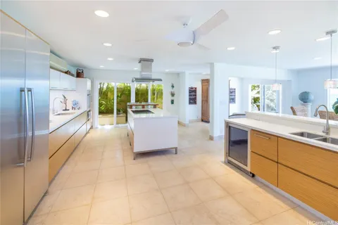 a large en suite bathroom with sink and mirror