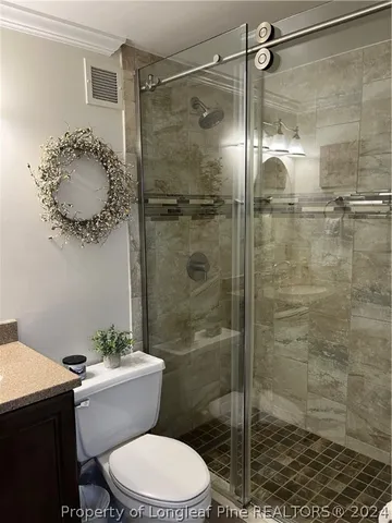 a bedroom with bed and a window