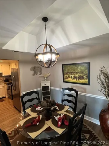 a kitchen with a table and chairs