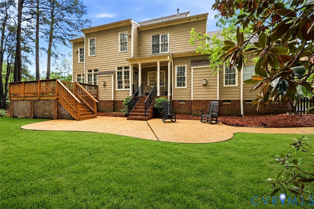4701 Regal Oaks Road Glen Allen, VA 23059 - Photo 52 of 60 a view of a house with a backyard and a tree