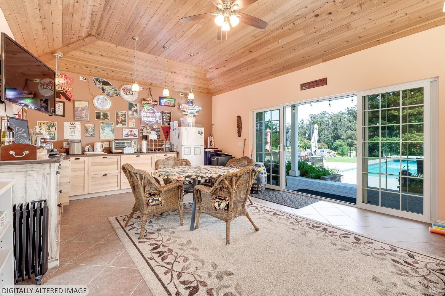 4760 Blank Road Sebastopol, CA 95472 - Photo 17 of 46 a dining room with furniture and a floor to ceiling window