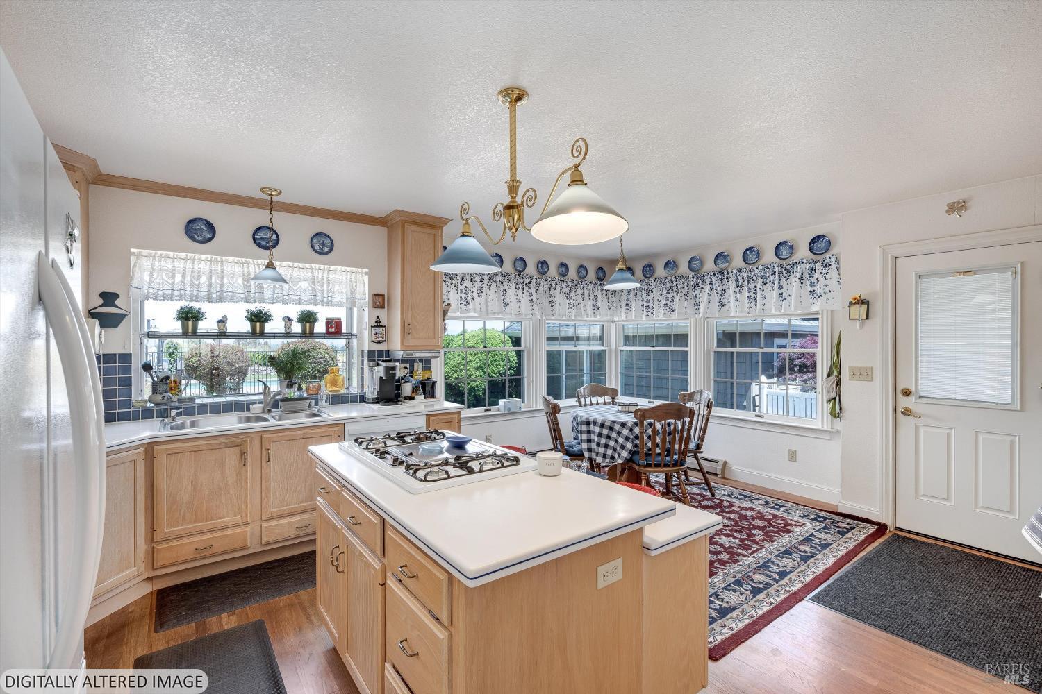 4760 Blank Road Sebastopol, CA 95472 - Photo 20 of 46 a kitchen with a stove a sink and cabinets