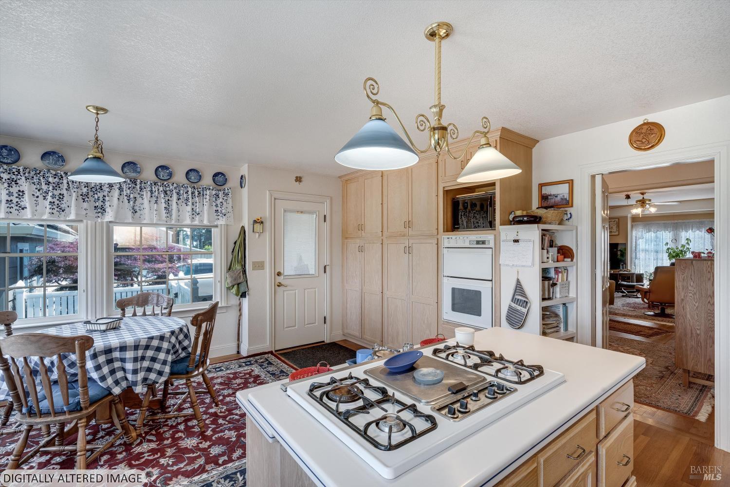 4760 Blank Road Sebastopol, CA 95472 - Photo 21 of 46 a kitchen with a table and chairs in it