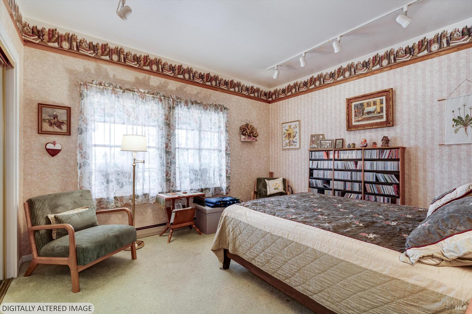 4760 Blank Road Sebastopol, CA 95472 - Photo 25 of 46 a spacious bedroom with a bed a couch and a window