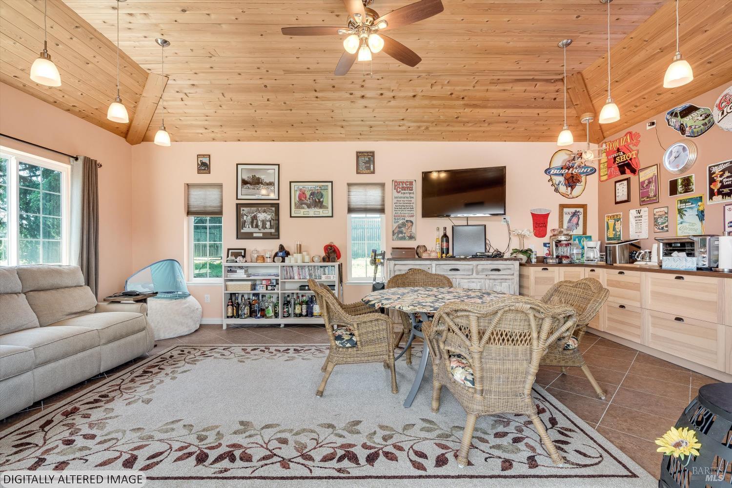 4760 Blank Road Sebastopol, CA 95472 - Photo 28 of 46 a living room with furniture and a flat screen tv