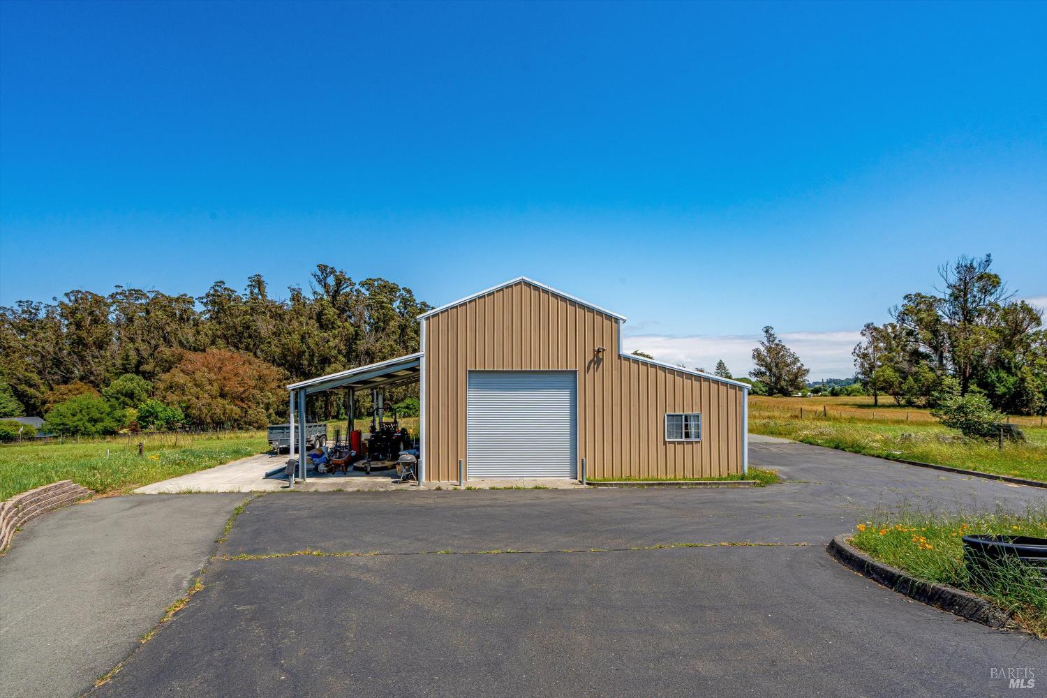 4760 Blank Road Sebastopol, CA 95472 - Photo 46 of 46 a view of a house with a yard and garage