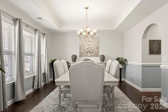 a view of a dining room with furniture and window