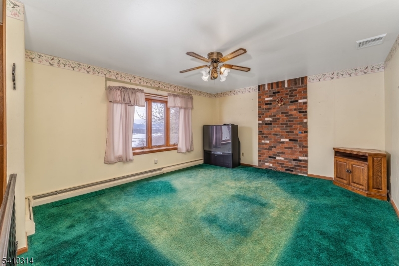 252 Mountain View Road West Asbury, NJ 08802 - Photo 9 of 28 a view of a big room with windows and cabinet