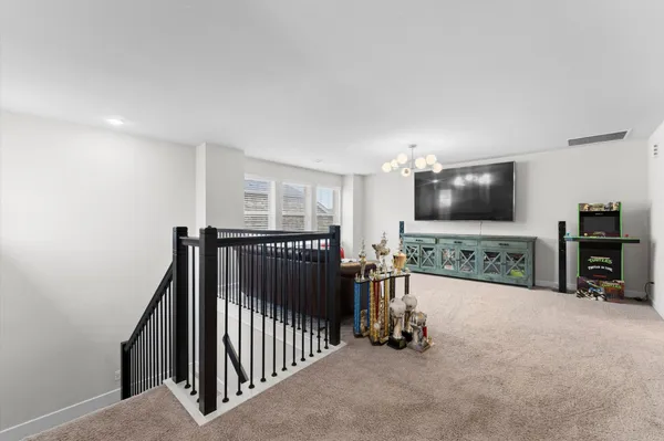 a view of a livingroom with furniture and a flat screen tv
