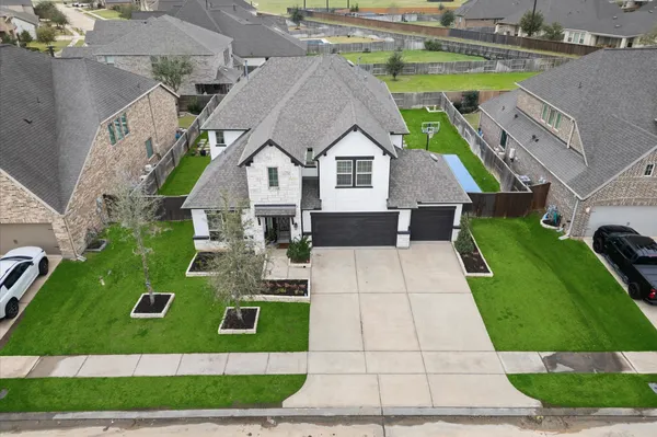 a aerial view of a house with a yard