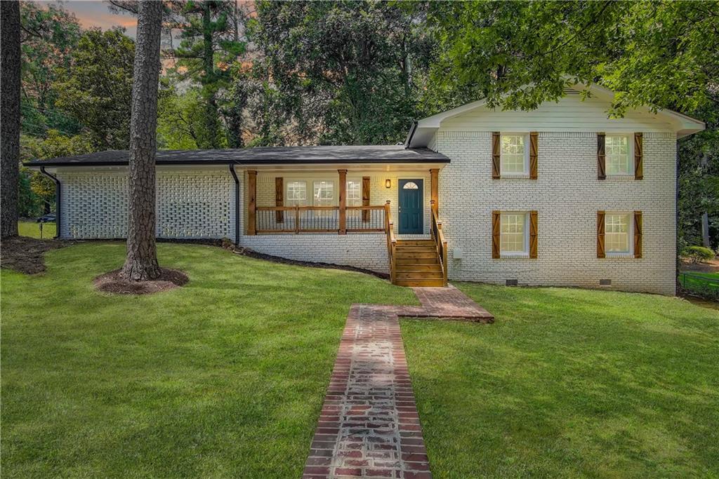 3375 Toney Drive Decatur, GA 30032 - Photo 1 of 1 a front view of a house with a yard and trees