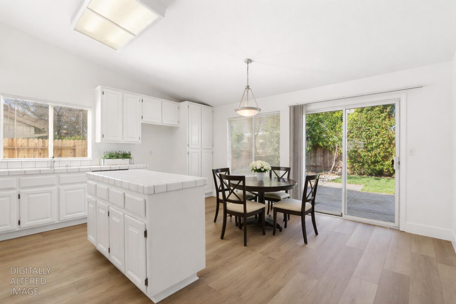 4730 Stuart Street Rocklin, CA 95765 - Photo 12 of 31 This photo has been virtually staged to show there is room for a kitchen nook table.