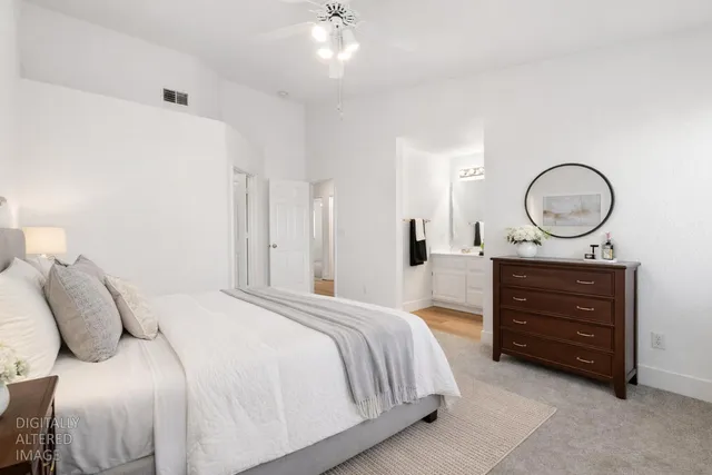 a bedroom with a bed and a dresser