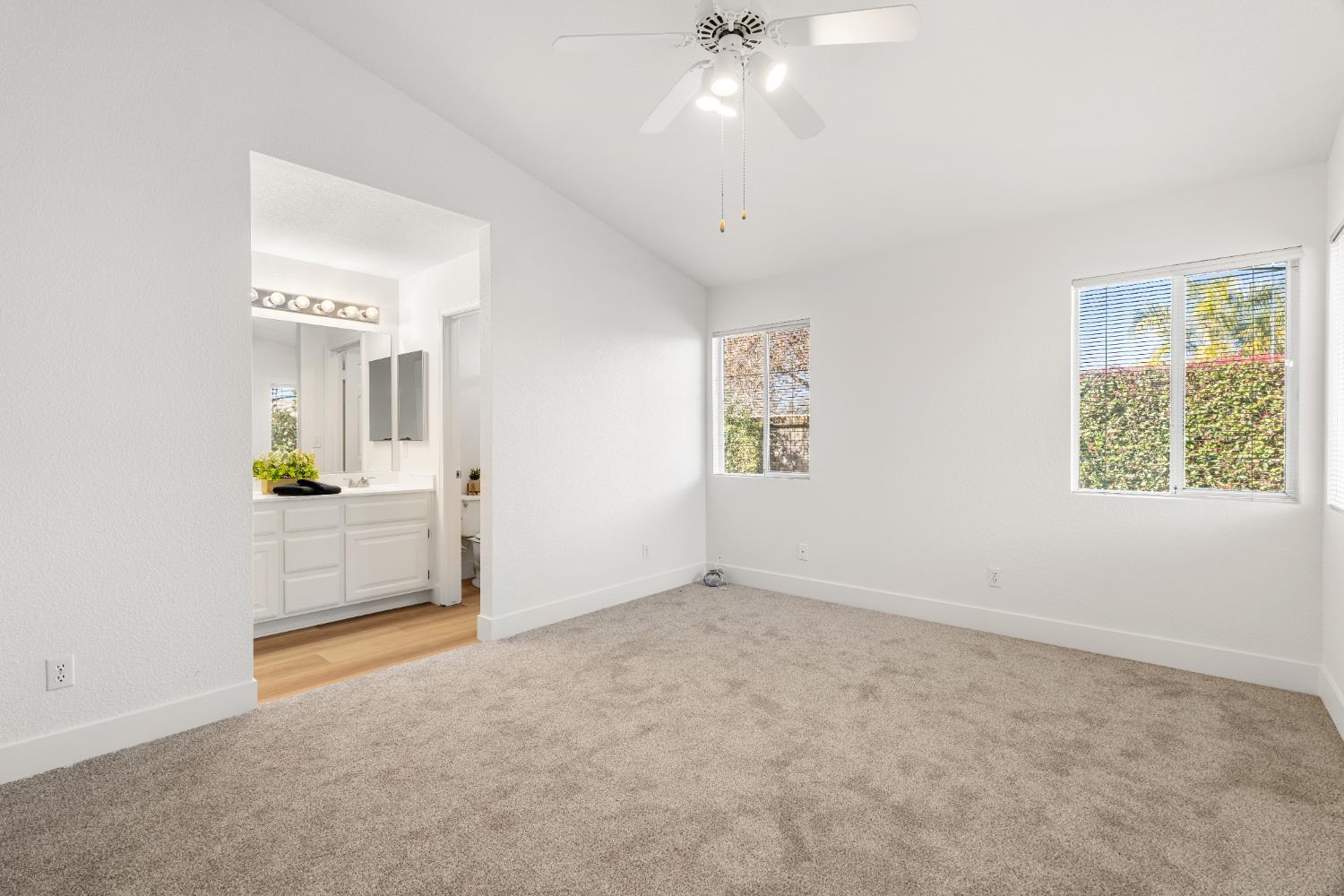 4730 Stuart Street Rocklin, CA 95765 - Photo 16 of 31 This is another view of the primary bedroom. The two windows look out onto the private backyard.