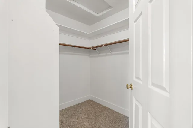 a bathroom with a double vanity sink toilet and shower