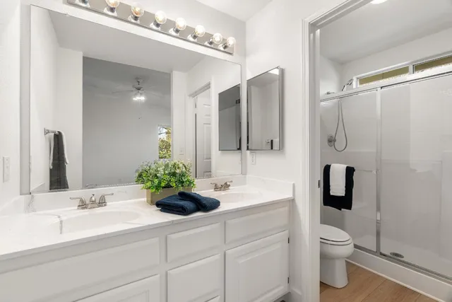 a bedroom with a bed and a potted plant