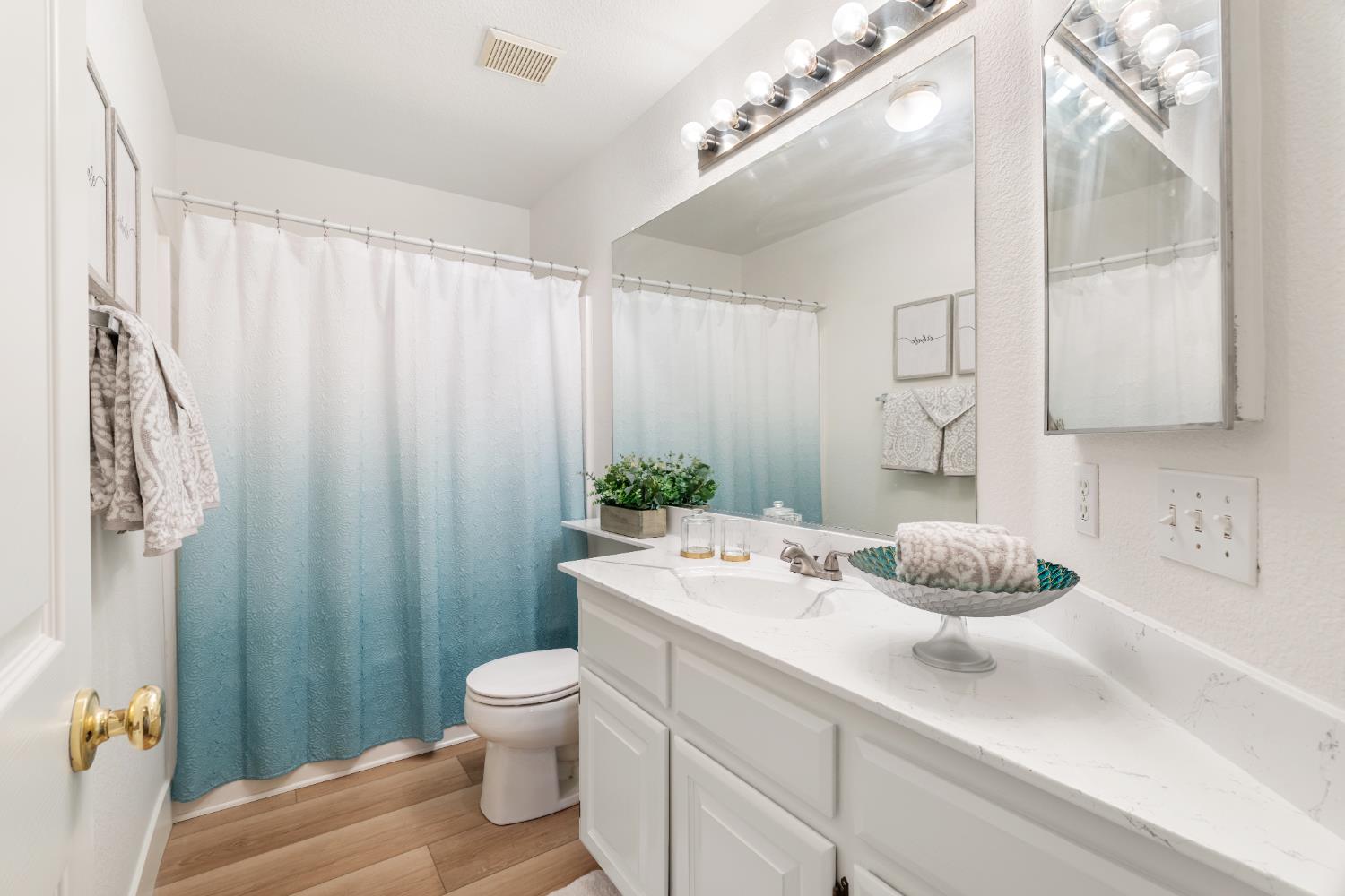 4730 Stuart Street Rocklin, CA 95765 - Photo 25 of 31 The bathroom off hallway has been updated with new LVP flooring and the counter and sink updated with special polyurethane paint professionally done.