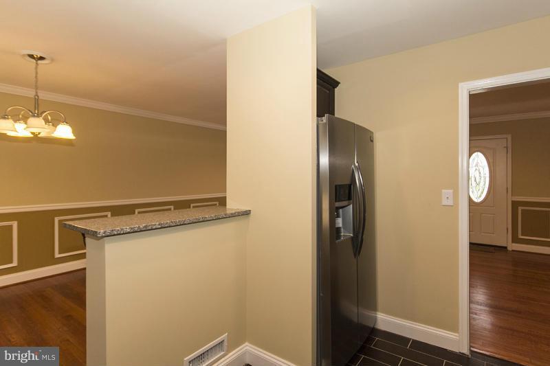 3405 Ripple Road Baltimore, MD 21244 - Photo 12 of 29 a view of an empty room with wooden floor