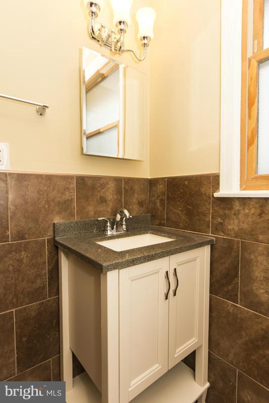 3405 Ripple Road Baltimore, MD 21244 - Photo 15 of 29 a bathroom with a sink and a mirror