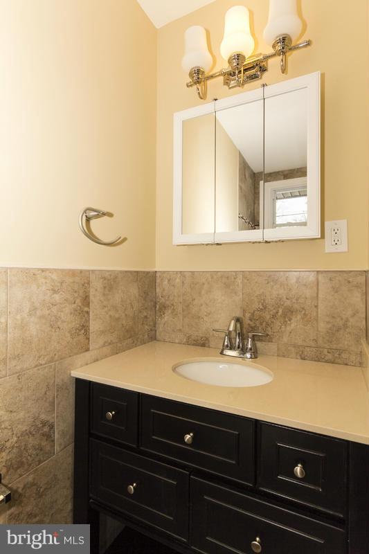 3405 Ripple Road Baltimore, MD 21244 - Photo 16 of 29 a bathroom with a sink and a mirror