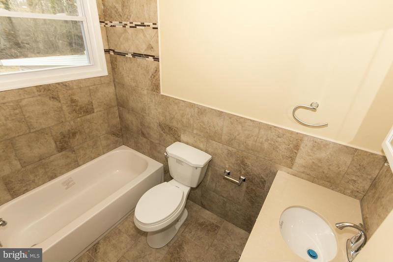 3405 Ripple Road Baltimore, MD 21244 - Photo 18 of 29 a bathroom with a sink and toilet