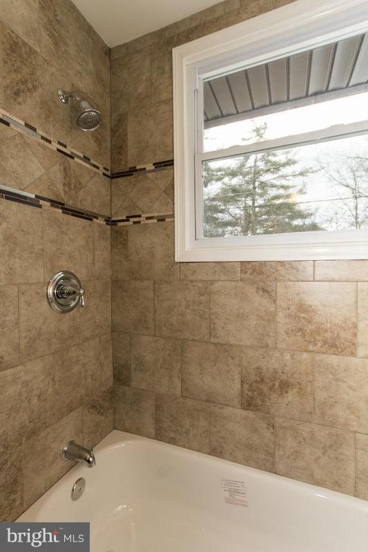3405 Ripple Road Baltimore, MD 21244 - Photo 19 of 29 a bathroom with a bathtub and shower