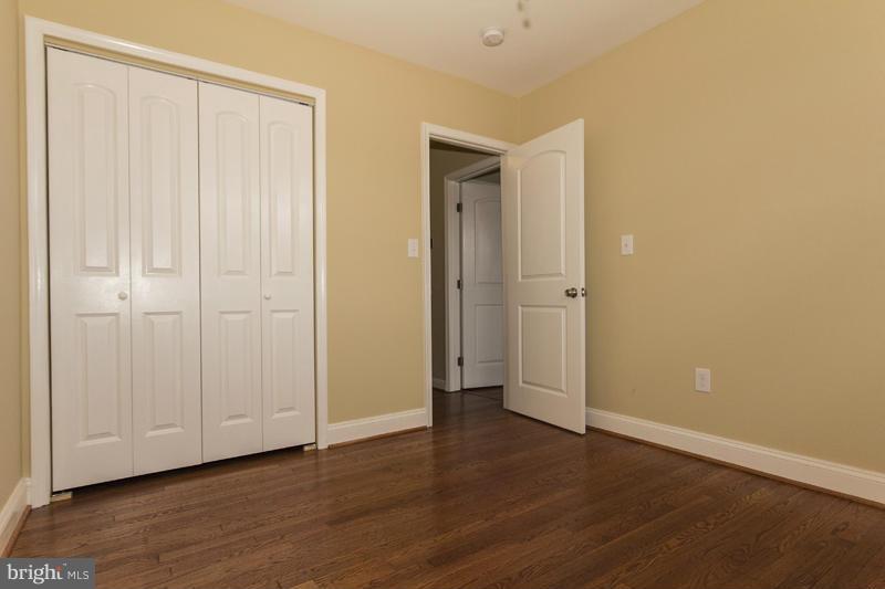 3405 Ripple Road Baltimore, MD 21244 - Photo 22 of 29 a view of an empty room with wooden floor