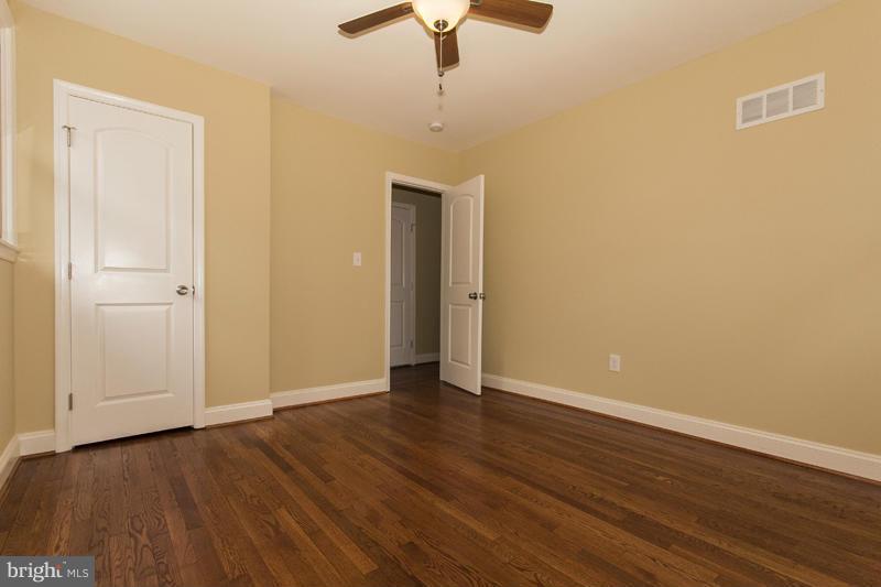 3405 Ripple Road Baltimore, MD 21244 - Photo 24 of 29 a view of an empty room with wooden floor