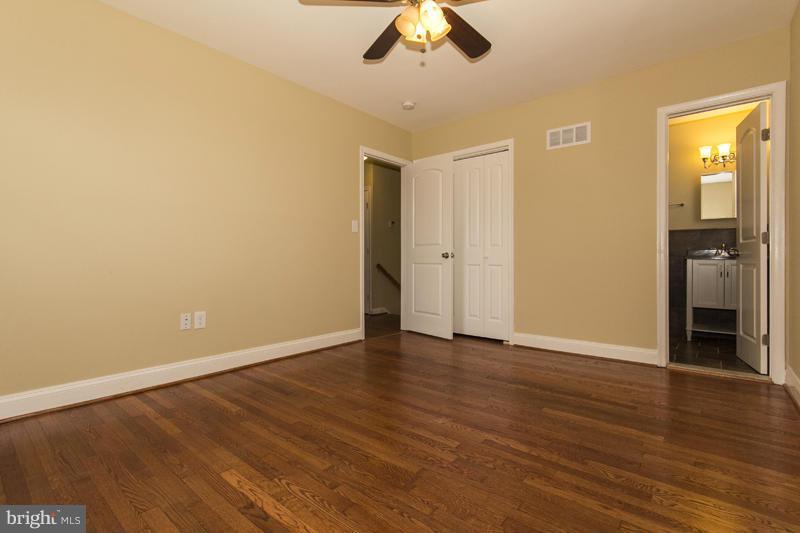 3405 Ripple Road Baltimore, MD 21244 - Photo 27 of 29 a view of an empty room with wooden floor