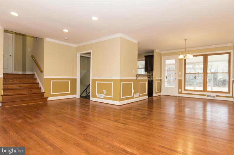 3405 Ripple Road Baltimore, MD 21244 - Photo 4 of 29 a view of an empty room with wooden floor and a window