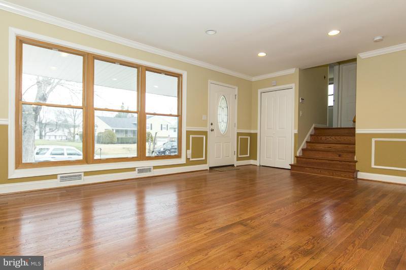 3405 Ripple Road Baltimore, MD 21244 - Photo 7 of 29 a view of an empty room with wooden floor and a window
